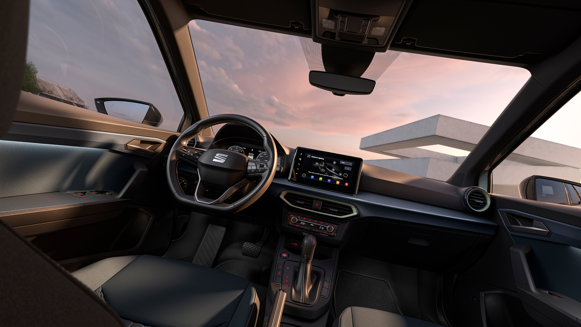 SEAT Arona interior showcasing details, such as part of the upholstery, the touchscreen or the steerign wheel.