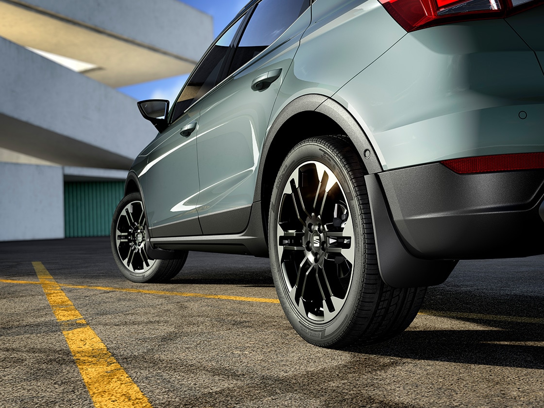 SEAT Arona in black with matching black front and rear mudflaps to protect and add style to the car.