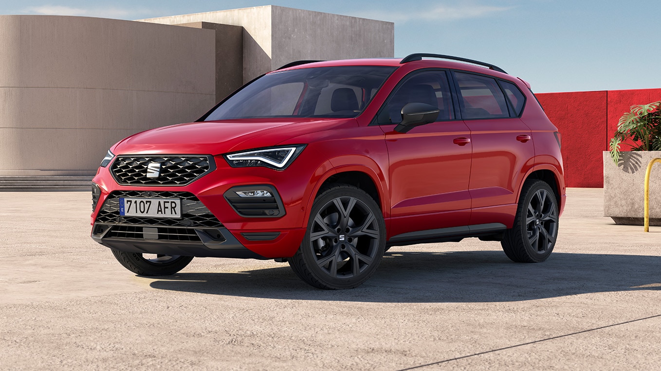 red seat ateca with aerodynamic urban bumpers and chrome roof rails.