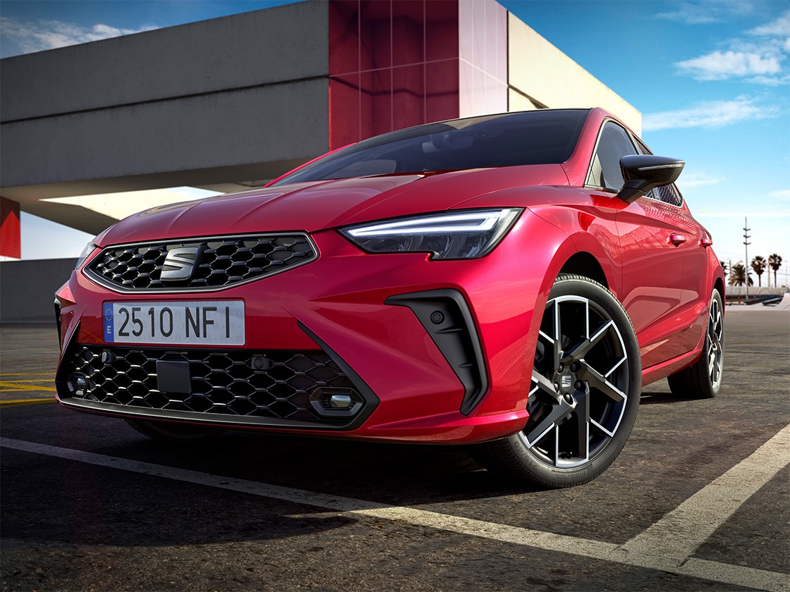 Low-angled view of the seat ibiza in red to highlight its fog lamps design.  Low-angled view of the seat ibiza in red to highlight its fog lamps design.