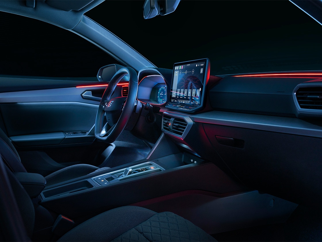 Wraparound led ambient lighting in the seat leon sportstourer hatchback, providing a cool design and safety features like alerts for open doors or blind spots.