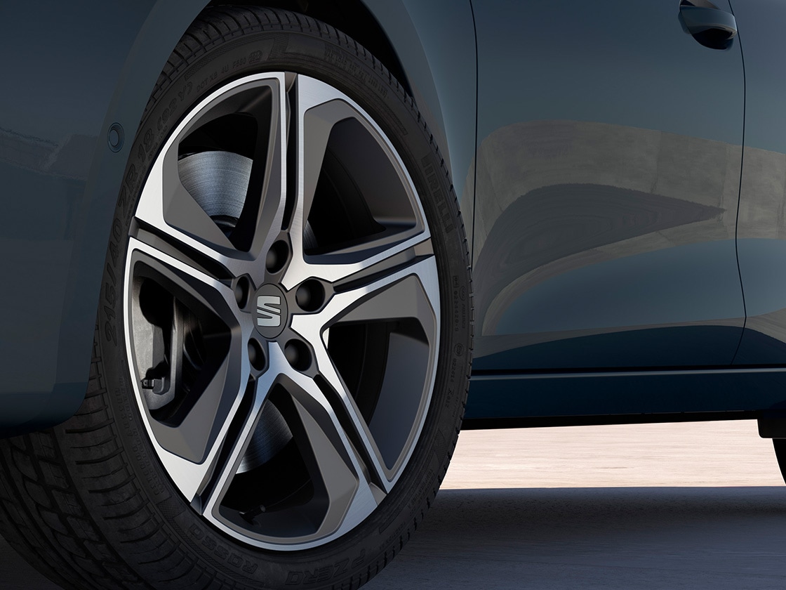 Performance 18 inch cosmo grey machined alloy wheels with sleek design and sharp contours.