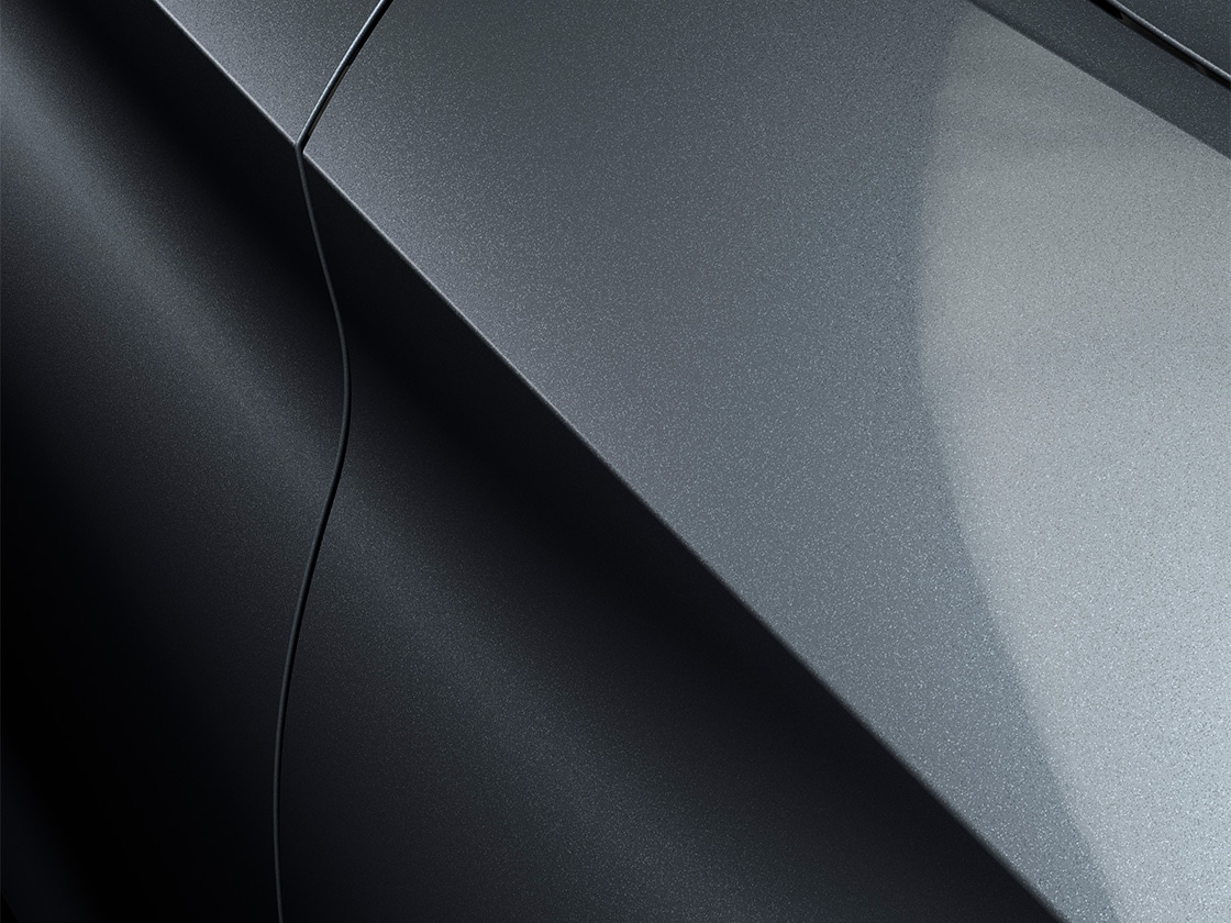 Seat leon sportstourer se in magnetic tech with a metallic finish, close up. 