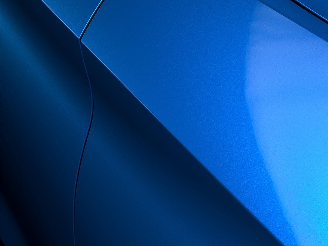 Seat leon sportstourer se with a sapphire blue metallic finish, close up.