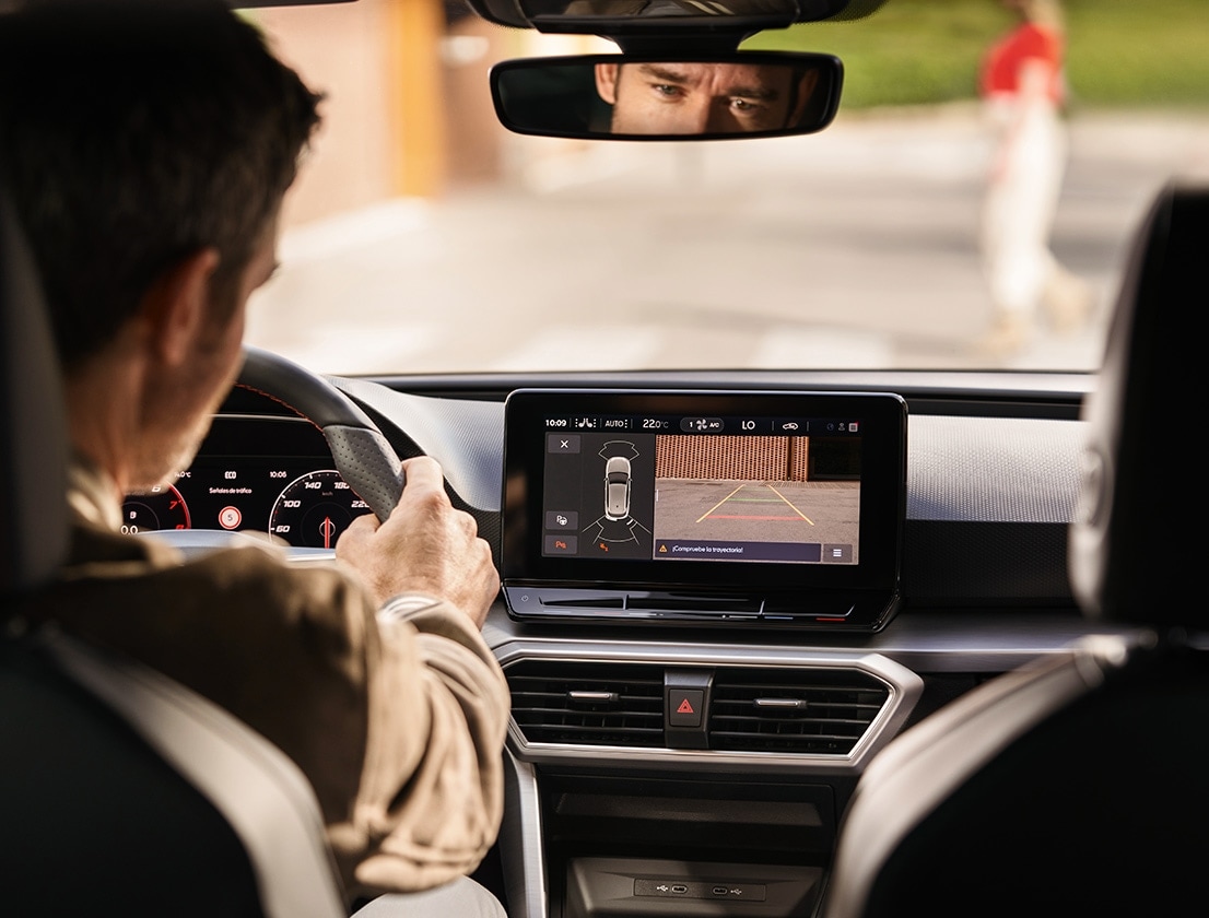 man using park assist with rearview camera