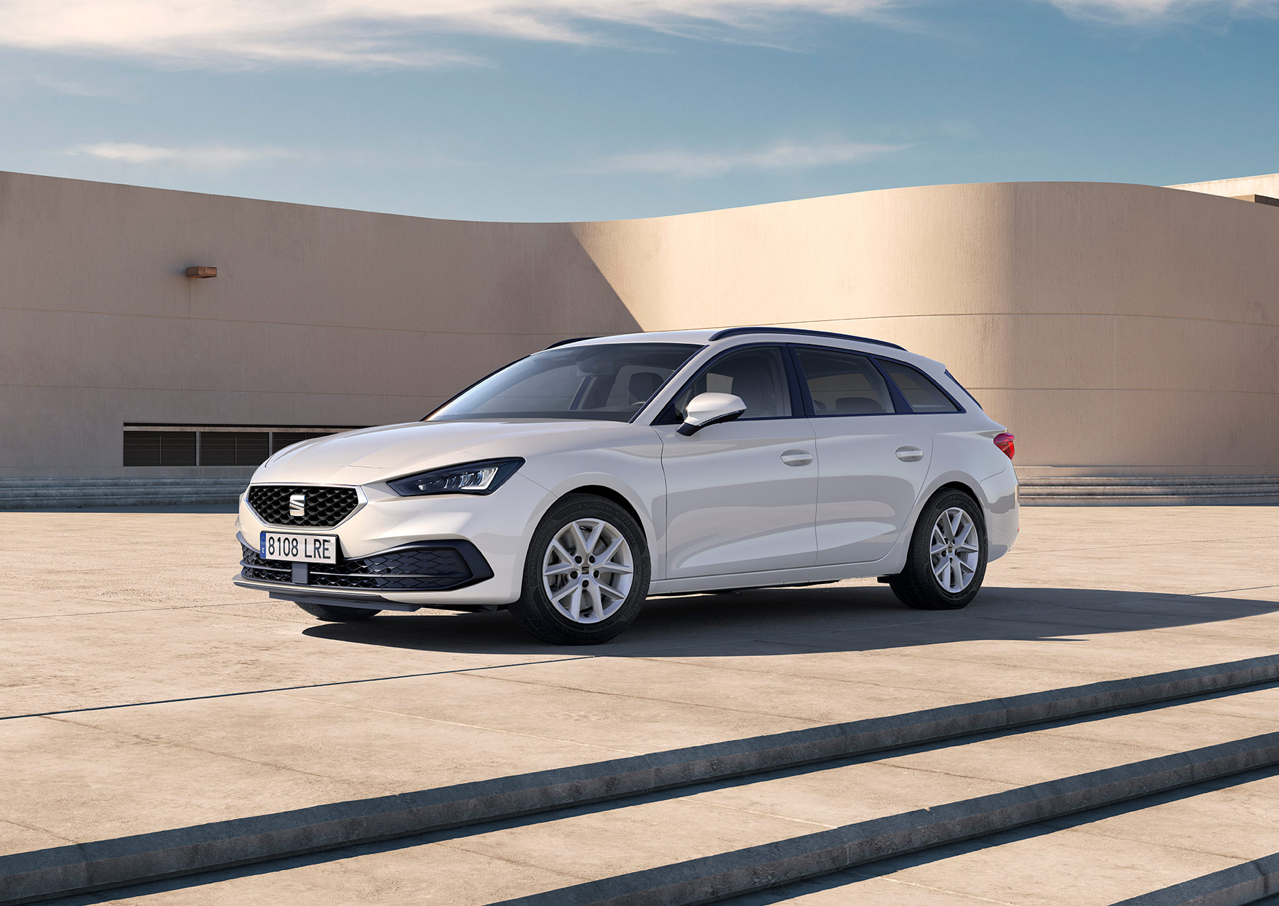 seat leon sportstourer se trim nevada white colour with dynamic alloy wheels parked