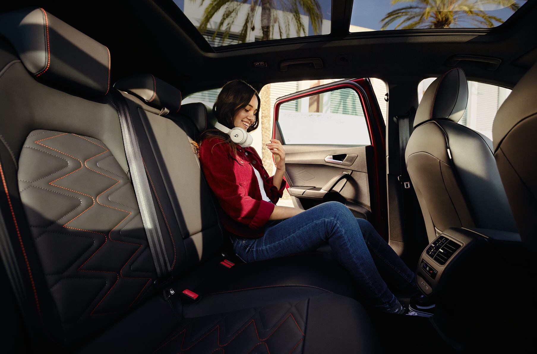 woman sitting in the seat leon dinamica microfiber sports seats.