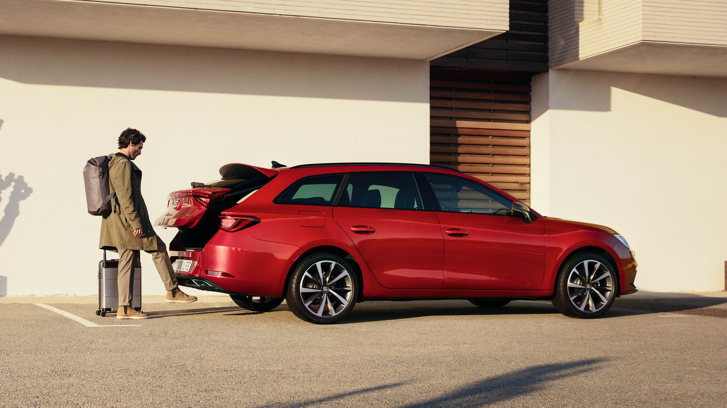 man opening seat leon desire red colour boot