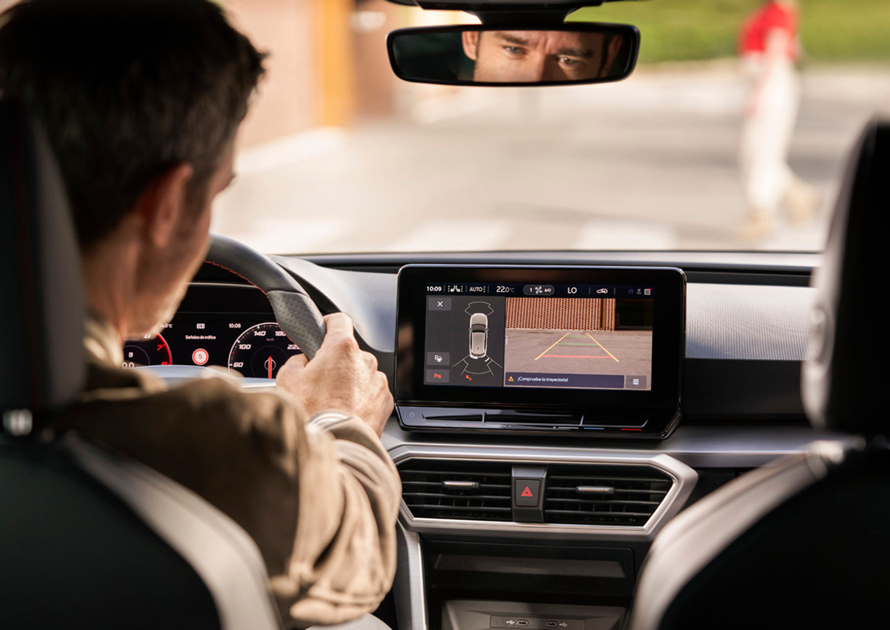 man driving a seat leon using the navigation system
