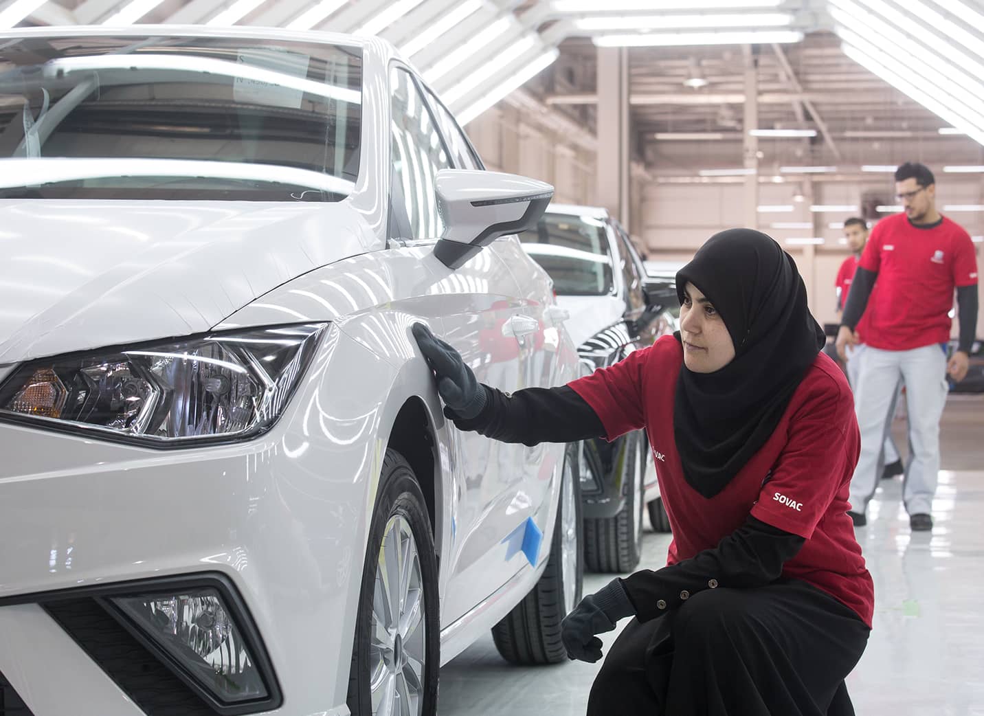 SEAT  We are globalFemale SEAT Factory inspecting a new car at the front left wheel – SEAT Human Resources