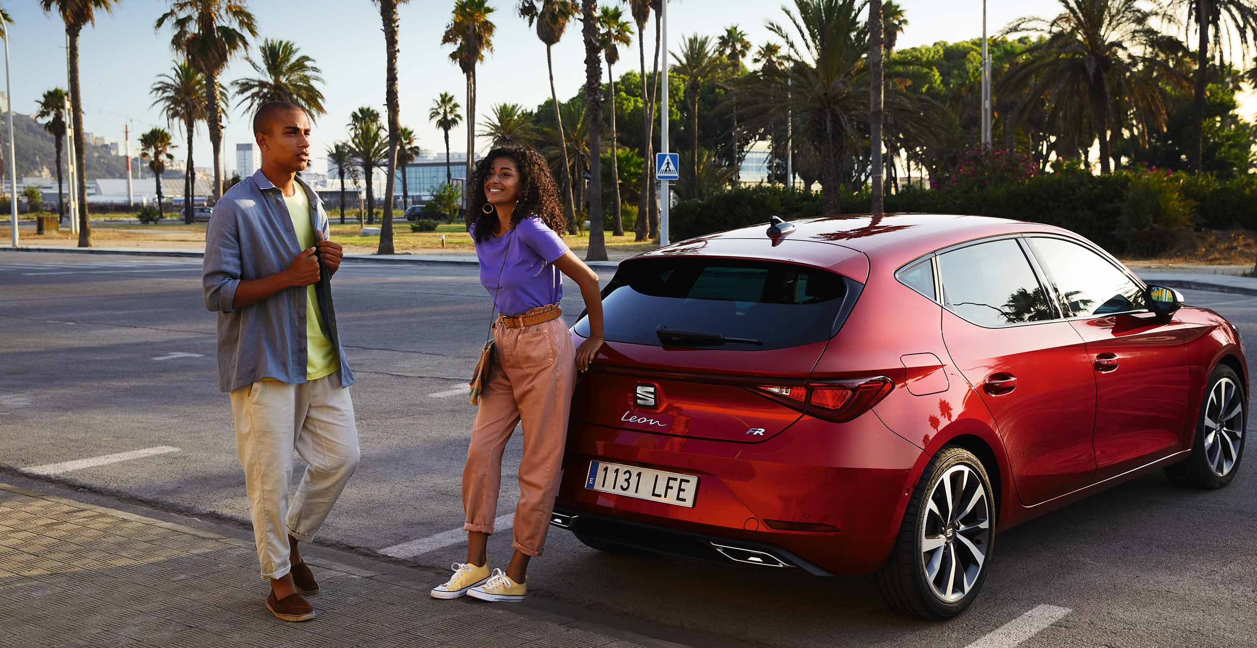 Front side view of the SEAT Arona. Woman ready to go for a journey