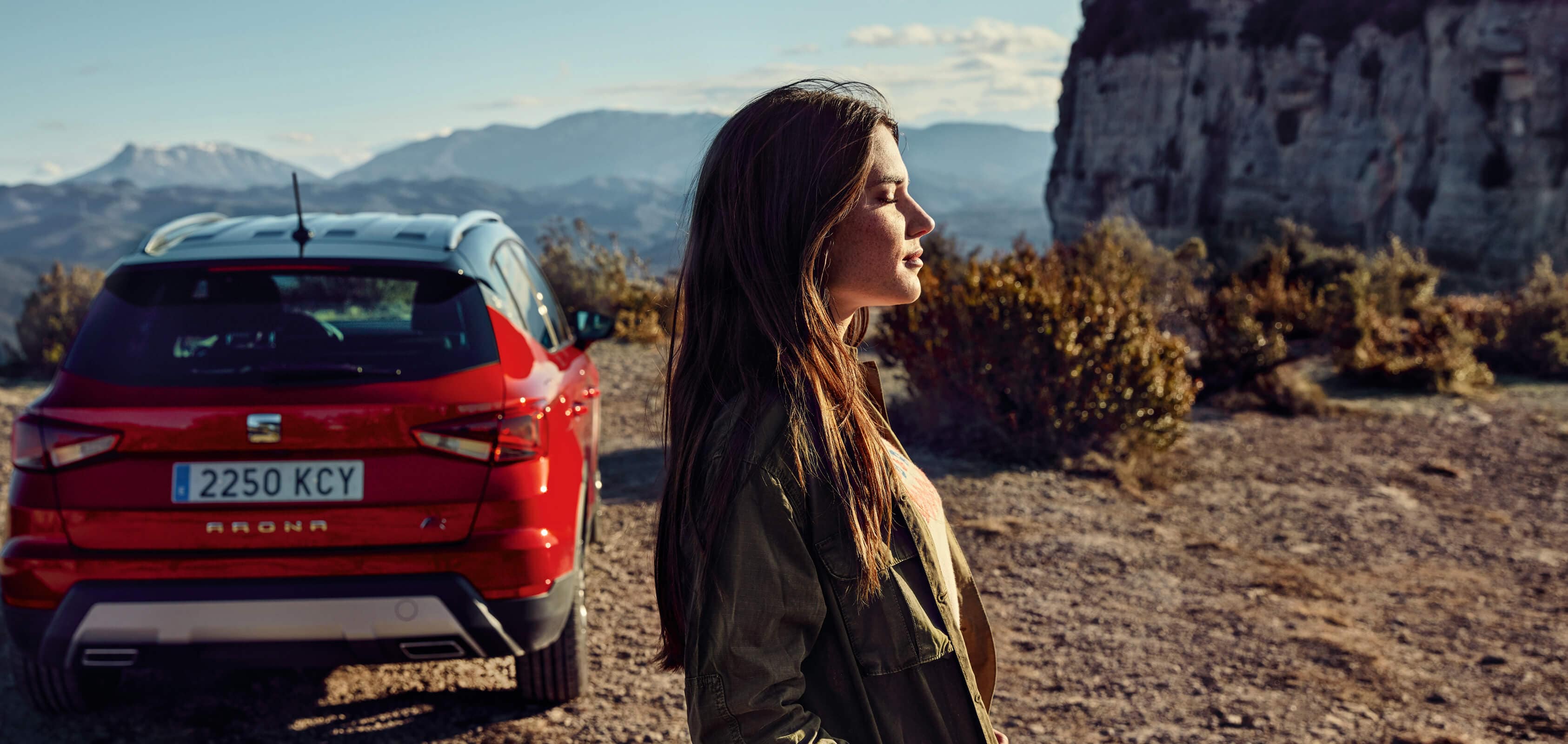 Woman next to SEAT Arona